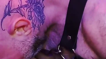 Inside a hardcore leather dungeon, a submissive guy is ready to obey every command. He gets fucked raw in his harness until he's creampied like a good slut.
