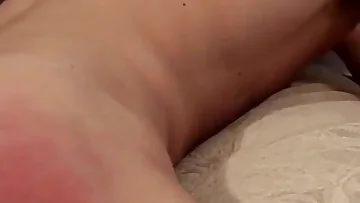Spanking that twink's ass until he's begging for mercy. His reddened cheeks show just how hard he's been punished.