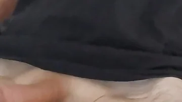 He's stroking his thick uncut cock at a frantic pace, edging himself without finishing. This amateur handjob session shows off every inch of his impressive equipment.