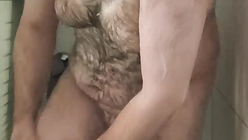 Soaping up this fat, hairy bear in the shower reveals every inch of his masculine body. His thick fur and heavy build make for one sexy fucking shower scene.