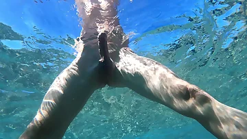 A big uncut boner flashes through ocean waves in this amateur solo showcase. The European stud's massive cock looks incredible against the natural backdrop.
