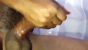 This Nigerian man is handling his morning wood with a intense solo session. He's stroking that black cock in a raw homemade video.