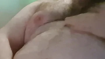 This chubby bear can't resist jerking off when he's home alone in the office. It's a homemade session where he gives in to his masturbation urges.