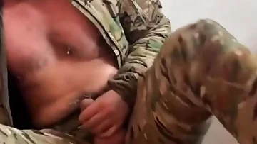 This buff military stud is stroking his massive cock while wearing camo. That army uniform can't contain all that muscular power and sheer size.