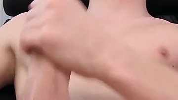 Shy teen Rustie shows off his amazing big cock for everyone to see. He works that massive dick until he cums hard.