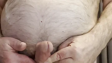 Coach Karl teases his sensitive nipples for your exclusive entertainment. Watch this mature, hairy bear pleasure himself in a raw solo performance.