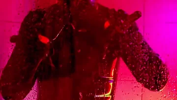 A slick latex-clad amateur gets off alone in his steamy bathroom. He slides his rubber-covered hand over his hard cock under the running shower water.