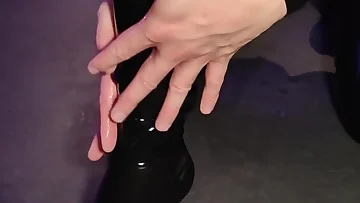 He's getting completely dominated while wearing shiny latex gear. This BDSM session is pushing all his fetish buttons hard.