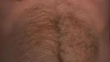 A hairy amateur strokes his thick cock alone at home in this intimate footage. Watch this masculine guy pleasure himself with rough, eager hands until he cums hard.