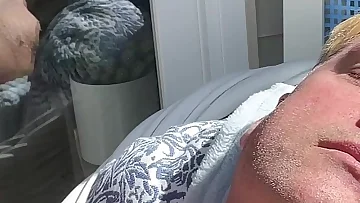 A bear daddy sunbathes completely naked, showing off his thick cock and big ass before jerking off. This outdoor solo session captures his raw, natural arousal under the sun.