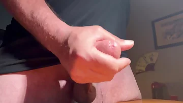 This chubby mature guy can't resist stroking his average cock while at work. He gives himself a proper handjob until he shoots his cum everywhere.