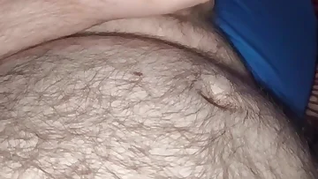 This hairy bear gets off by stroking his thick cock over his massive belly. Watch him work up a sweaty load all over his furry gut.