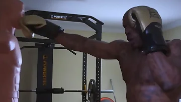 This muscular black gym guy pumps his hard cock in an intense solo session after lifting. The African amateur shows off his ripped body and massive dick in this homemade workout fantasy.